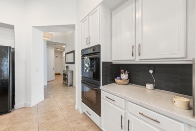 Step into this upgraded Islands 3 model that has been remodeled on Oasis Country Club in California - for sale on GolfHomes.com, golf home, golf lot