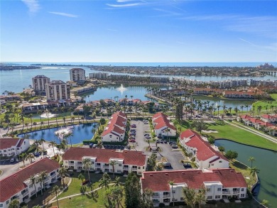 Relaxing is easy from this ideally located golf course condo in on Isla Del Sol Yacht and Country Club in Florida - for sale on GolfHomes.com, golf home, golf lot