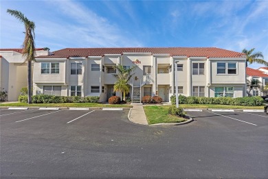 Relaxing is easy from this ideally located golf course condo in on Isla Del Sol Yacht and Country Club in Florida - for sale on GolfHomes.com, golf home, golf lot