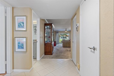 Relaxing is easy from this ideally located golf course condo in on Isla Del Sol Yacht and Country Club in Florida - for sale on GolfHomes.com, golf home, golf lot