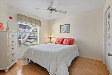 Relaxing is easy from this ideally located golf course condo in on Isla Del Sol Yacht and Country Club in Florida - for sale on GolfHomes.com, golf home, golf lot