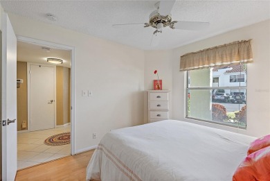 Relaxing is easy from this ideally located golf course condo in on Isla Del Sol Yacht and Country Club in Florida - for sale on GolfHomes.com, golf home, golf lot