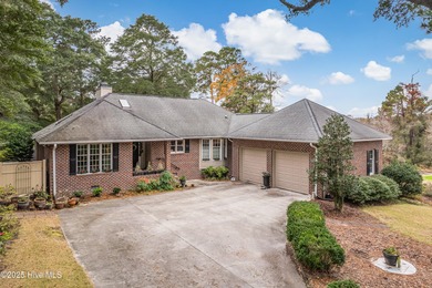 Beautiful brick home tucked away on a quiet cul-de-sac with on Sea Trail Golf Resort in North Carolina - for sale on GolfHomes.com, golf home, golf lot