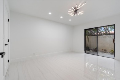 Recently updated and remodeled villa on the lake in Boca Lagoe on Boca Lago Golf and Country Club in Florida - for sale on GolfHomes.com, golf home, golf lot