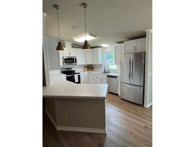 This is a newly remodeled mobile home in Horseshoe Bend Air Park on Horseshoe Bend Country Club in Texas - for sale on GolfHomes.com, golf home, golf lot