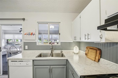 AFFORDABLE & ADORABLE! This charming, TURN-KEY FURNISHED on Duffys Golf Center in Florida - for sale on GolfHomes.com, golf home, golf lot