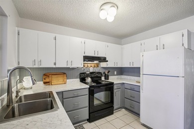 AFFORDABLE & ADORABLE! This charming, TURN-KEY FURNISHED on Duffys Golf Center in Florida - for sale on GolfHomes.com, golf home, golf lot