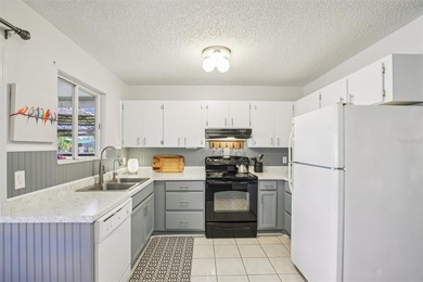 AFFORDABLE & ADORABLE! This charming, TURN-KEY FURNISHED on Duffys Golf Center in Florida - for sale on GolfHomes.com, golf home, golf lot