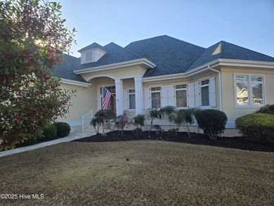 This charming ranch-style home with views Lion's Paw Golf Course on Ocean Ridge Plantation in North Carolina - for sale on GolfHomes.com, golf home, golf lot
