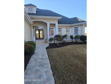 This charming ranch-style home with views Lion's Paw Golf Course on Ocean Ridge Plantation in North Carolina - for sale on GolfHomes.com, golf home, golf lot