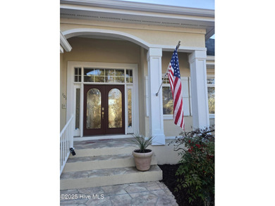 This charming ranch-style home with views Lion's Paw Golf Course on Ocean Ridge Plantation in North Carolina - for sale on GolfHomes.com, golf home, golf lot