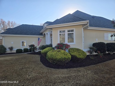 This charming ranch-style home with views Lion's Paw Golf Course on Ocean Ridge Plantation in North Carolina - for sale on GolfHomes.com, golf home, golf lot