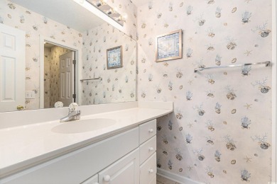 This spacious and well-maintained first-floor end unit features on River Oaks Golf Plantation  in South Carolina - for sale on GolfHomes.com, golf home, golf lot