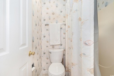 This spacious and well-maintained first-floor end unit features on River Oaks Golf Plantation  in South Carolina - for sale on GolfHomes.com, golf home, golf lot
