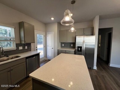 The Kent, built by Dream Finders Homes, is a stunning on Harbour Point Golf Club in North Carolina - for sale on GolfHomes.com, golf home, golf lot