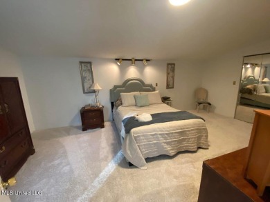 Canal front Coastal Home. Remodeled in 2023. 2 story modern on Mississippi National Golf Course in Mississippi - for sale on GolfHomes.com, golf home, golf lot