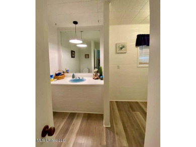 Canal front Coastal Home. Remodeled in 2023. 2 story modern on Mississippi National Golf Course in Mississippi - for sale on GolfHomes.com, golf home, golf lot