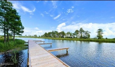 Canal front Coastal Home. Remodeled in 2023. 2 story modern on Mississippi National Golf Course in Mississippi - for sale on GolfHomes.com, golf home, golf lot