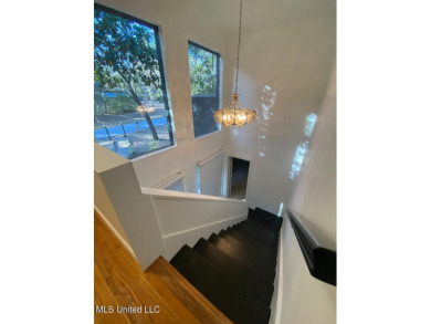 Canal front Coastal Home. Remodeled in 2023. 2 story modern on Mississippi National Golf Course in Mississippi - for sale on GolfHomes.com, golf home, golf lot