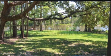 Canal front Coastal Home. Remodeled in 2023. 2 story modern on Mississippi National Golf Course in Mississippi - for sale on GolfHomes.com, golf home, golf lot