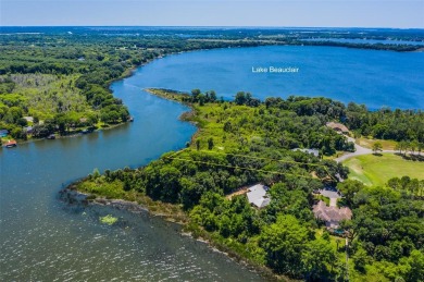 MOTIVATED SELLER! Come enjoy this fabulous lakefront lot on Lake on Deer Island Country Club in Florida - for sale on GolfHomes.com, golf home, golf lot