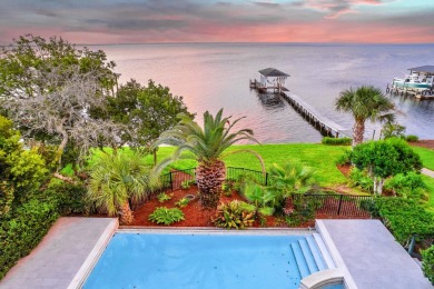 Timeless elegance on the bay behind the gates of prestigious on Regatta Bay Golf and Country Club in Florida - for sale on GolfHomes.com, golf home, golf lot