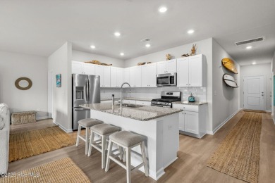 Welcome to this impeccably maintained 3-bedroom, 2-bathroom home on Ocean Ridge Plantation in North Carolina - for sale on GolfHomes.com, golf home, golf lot