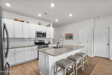 Welcome to this impeccably maintained 3-bedroom, 2-bathroom home on Ocean Ridge Plantation in North Carolina - for sale on GolfHomes.com, golf home, golf lot