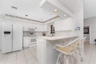 Light, bright, and filled with peaceful pond views, this on Oyster Creek Golf Club in Florida - for sale on GolfHomes.com, golf home, golf lot