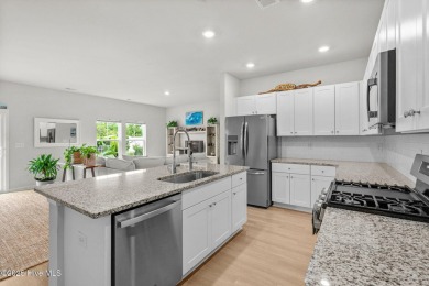 Welcome to this impeccably maintained 3-bedroom, 2-bathroom home on Ocean Ridge Plantation in North Carolina - for sale on GolfHomes.com, golf home, golf lot