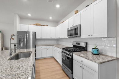 Welcome to this impeccably maintained 3-bedroom, 2-bathroom home on Ocean Ridge Plantation in North Carolina - for sale on GolfHomes.com, golf home, golf lot