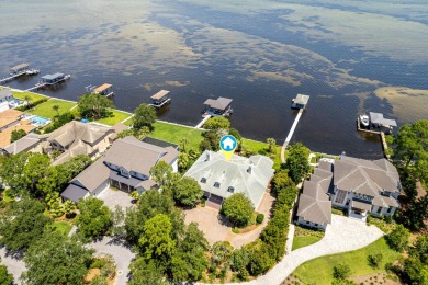 Timeless elegance on the bay behind the gates of prestigious on Regatta Bay Golf and Country Club in Florida - for sale on GolfHomes.com, golf home, golf lot