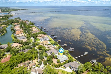 Timeless elegance on the bay behind the gates of prestigious on Regatta Bay Golf and Country Club in Florida - for sale on GolfHomes.com, golf home, golf lot