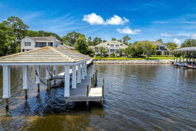 Timeless elegance on the bay behind the gates of prestigious on Regatta Bay Golf and Country Club in Florida - for sale on GolfHomes.com, golf home, golf lot