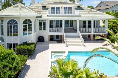 Timeless elegance on the bay behind the gates of prestigious on Regatta Bay Golf and Country Club in Florida - for sale on GolfHomes.com, golf home, golf lot