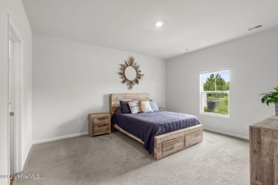 Welcome to this impeccably maintained 3-bedroom, 2-bathroom home on Ocean Ridge Plantation in North Carolina - for sale on GolfHomes.com, golf home, golf lot
