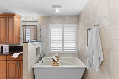 Welcome to your dream home in the exclusive gated community of on East Lake Woodlands Country Club in Florida - for sale on GolfHomes.com, golf home, golf lot