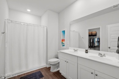 Welcome to this impeccably maintained 3-bedroom, 2-bathroom home on Ocean Ridge Plantation in North Carolina - for sale on GolfHomes.com, golf home, golf lot