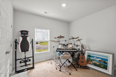 Welcome to this impeccably maintained 3-bedroom, 2-bathroom home on Ocean Ridge Plantation in North Carolina - for sale on GolfHomes.com, golf home, golf lot