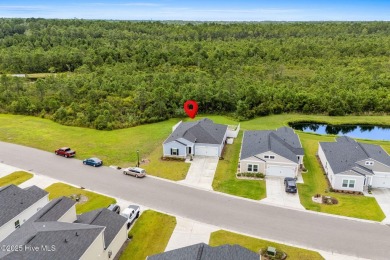 Welcome to this impeccably maintained 3-bedroom, 2-bathroom home on Ocean Ridge Plantation in North Carolina - for sale on GolfHomes.com, golf home, golf lot