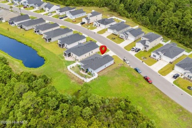 Welcome to this impeccably maintained 3-bedroom, 2-bathroom home on Ocean Ridge Plantation in North Carolina - for sale on GolfHomes.com, golf home, golf lot