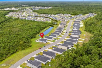 Welcome to this impeccably maintained 3-bedroom, 2-bathroom home on Ocean Ridge Plantation in North Carolina - for sale on GolfHomes.com, golf home, golf lot