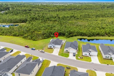 Welcome to this impeccably maintained 3-bedroom, 2-bathroom home on Ocean Ridge Plantation in North Carolina - for sale on GolfHomes.com, golf home, golf lot
