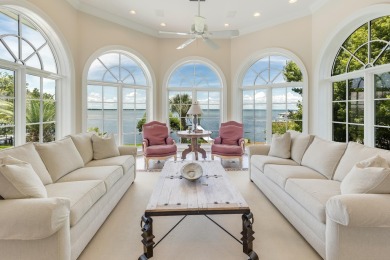 Timeless elegance on the bay behind the gates of prestigious on Regatta Bay Golf and Country Club in Florida - for sale on GolfHomes.com, golf home, golf lot