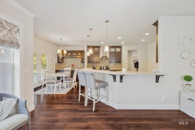This stunning, custom-built home features both a primary and on Hunters Point Golf Club in Idaho - for sale on GolfHomes.com, golf home, golf lot
