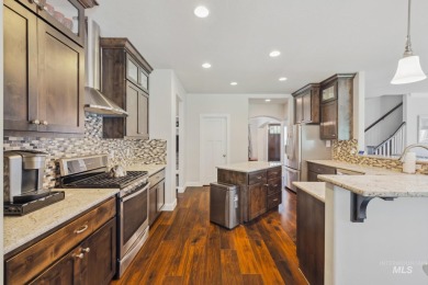 This stunning, custom-built home features both a primary and on Hunters Point Golf Club in Idaho - for sale on GolfHomes.com, golf home, golf lot