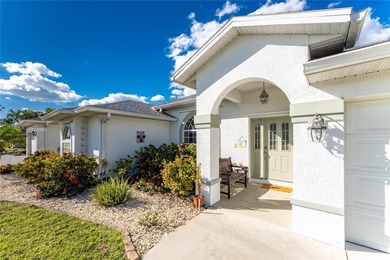 A Poolside Retreat with Peaceful Canal Views in Rotonda West's on Pinemoor West Golf Club in Florida - for sale on GolfHomes.com, golf home, golf lot