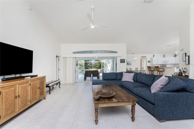 A Poolside Retreat with Peaceful Canal Views in Rotonda West's on Pinemoor West Golf Club in Florida - for sale on GolfHomes.com, golf home, golf lot