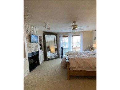 Tucked away on a wooded double-parcel lot, this exceptional on Redwood Falls Golf Club in Minnesota - for sale on GolfHomes.com, golf home, golf lot