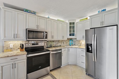 Enjoy stunning ocean and golf course views from this beautifully on Ocean Village Golf Course in Florida - for sale on GolfHomes.com, golf home, golf lot